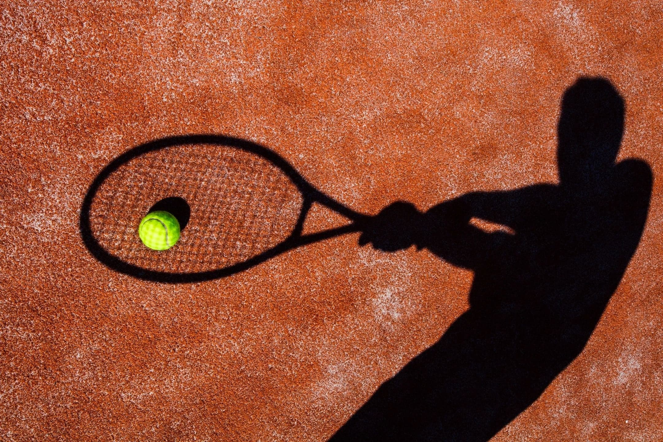Racket sports player in motion. Performance therapy serving Oxford, MI from our Lake Orion clinic